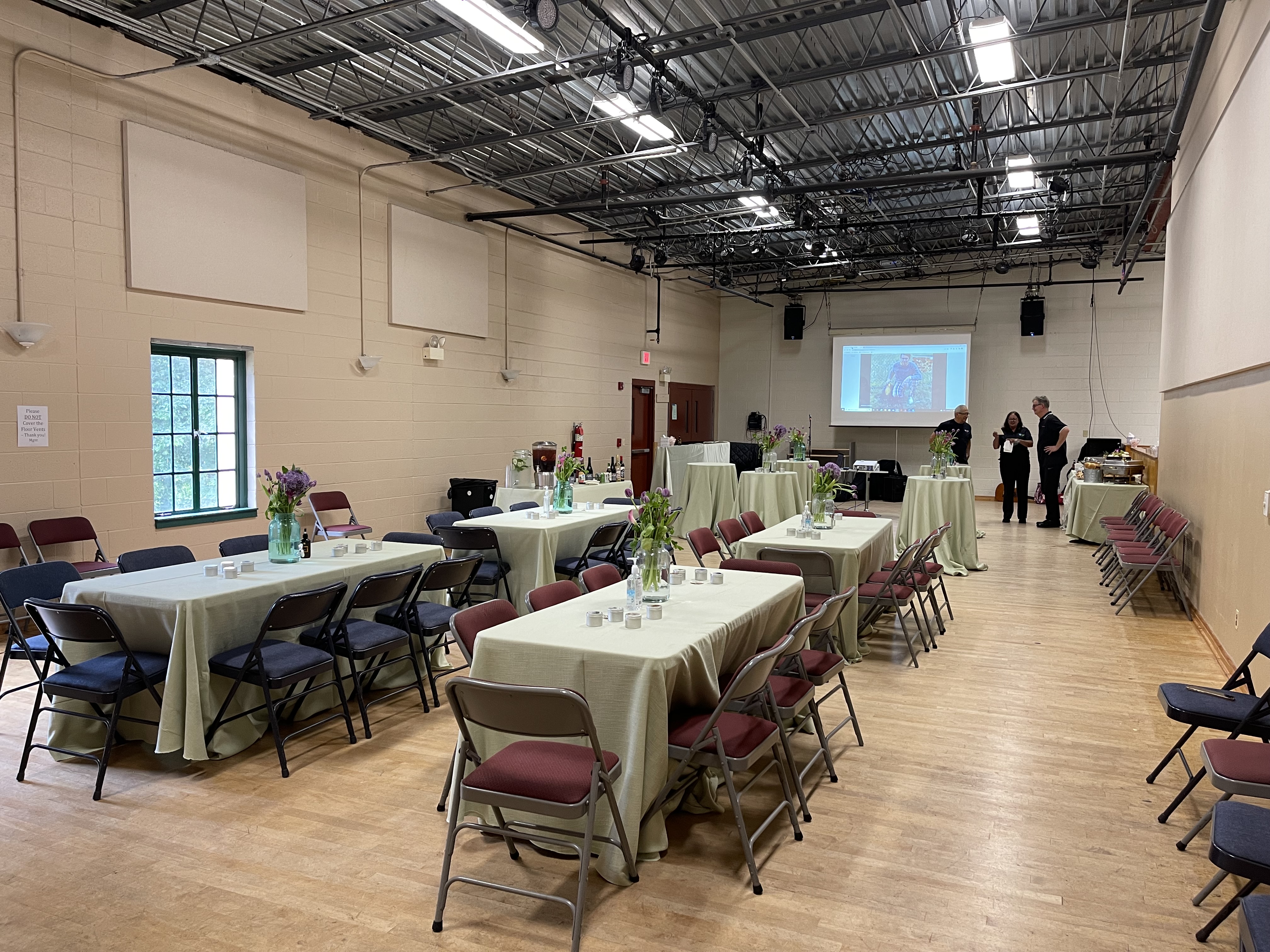 A space with hardwood floors and tables