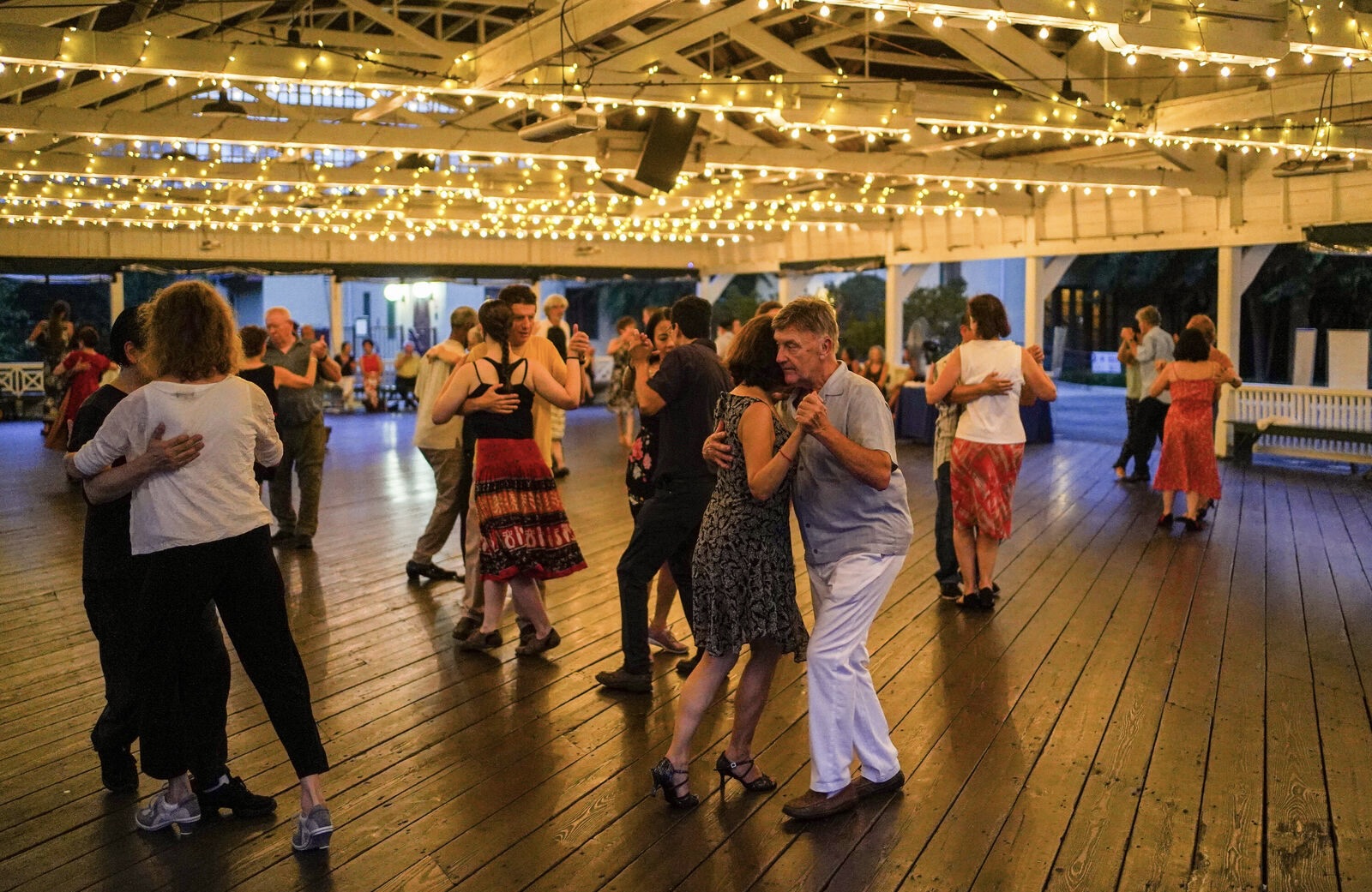 Dancers in the Bumper Car Pavilion at night